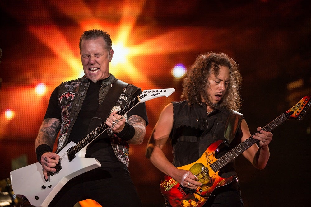 James Hetfield and Kirk Hammett play guitar for Metallica