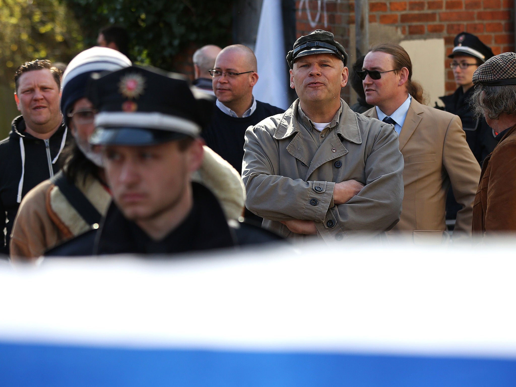German neo-Nazi Thomas Wulff (C) stands in front of the venue