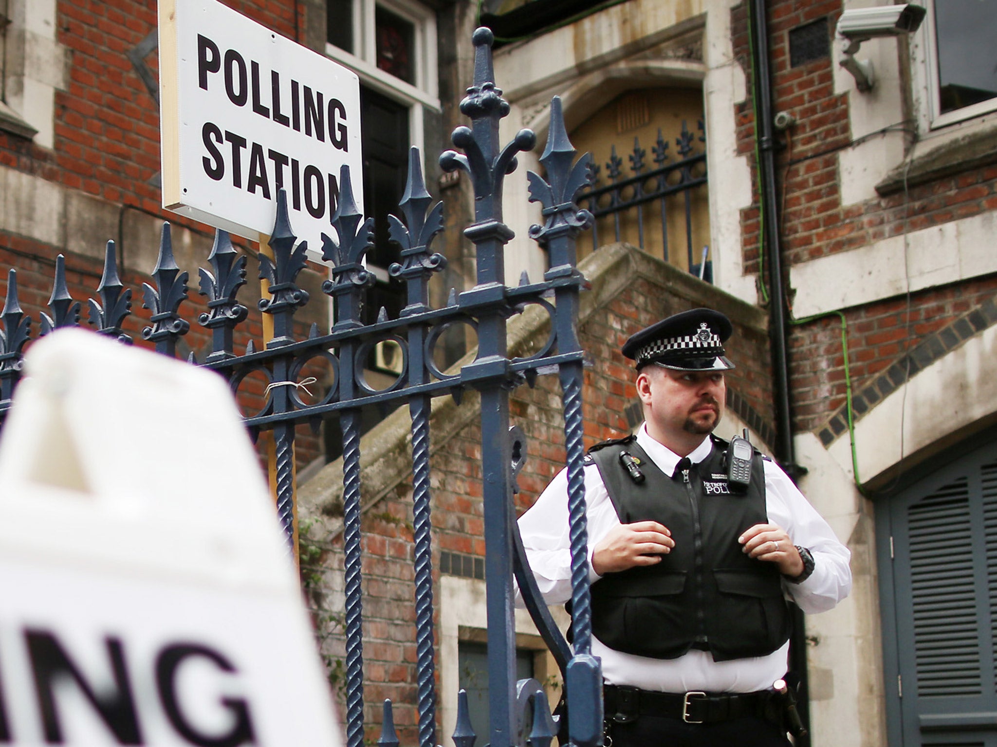 A police officer outside a polling station in Tower Hamlets during last May’s local elections following accusations of voter intimidation in the area