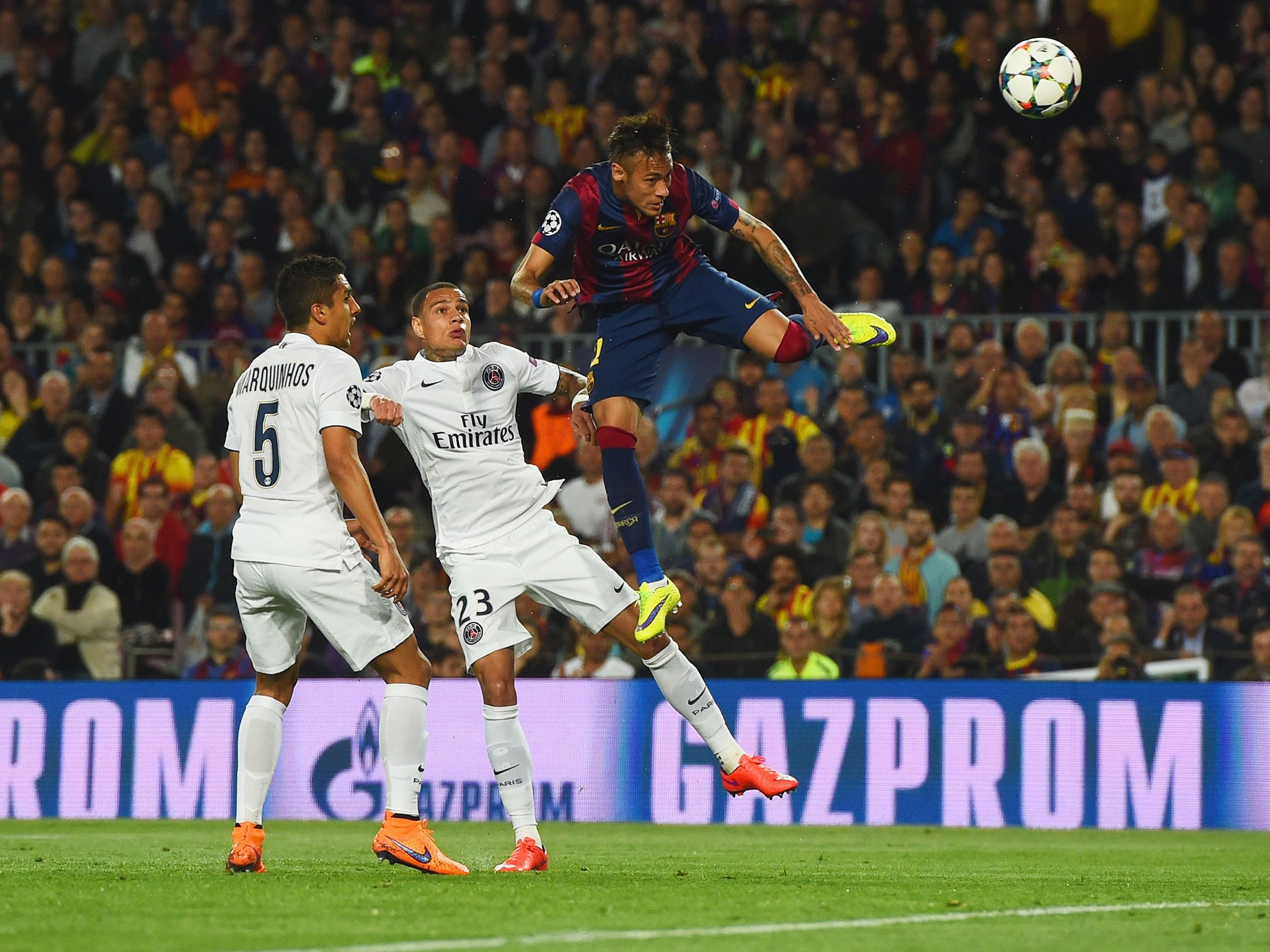 Neymar leaps to meet Dani Alves' cross and head home the second