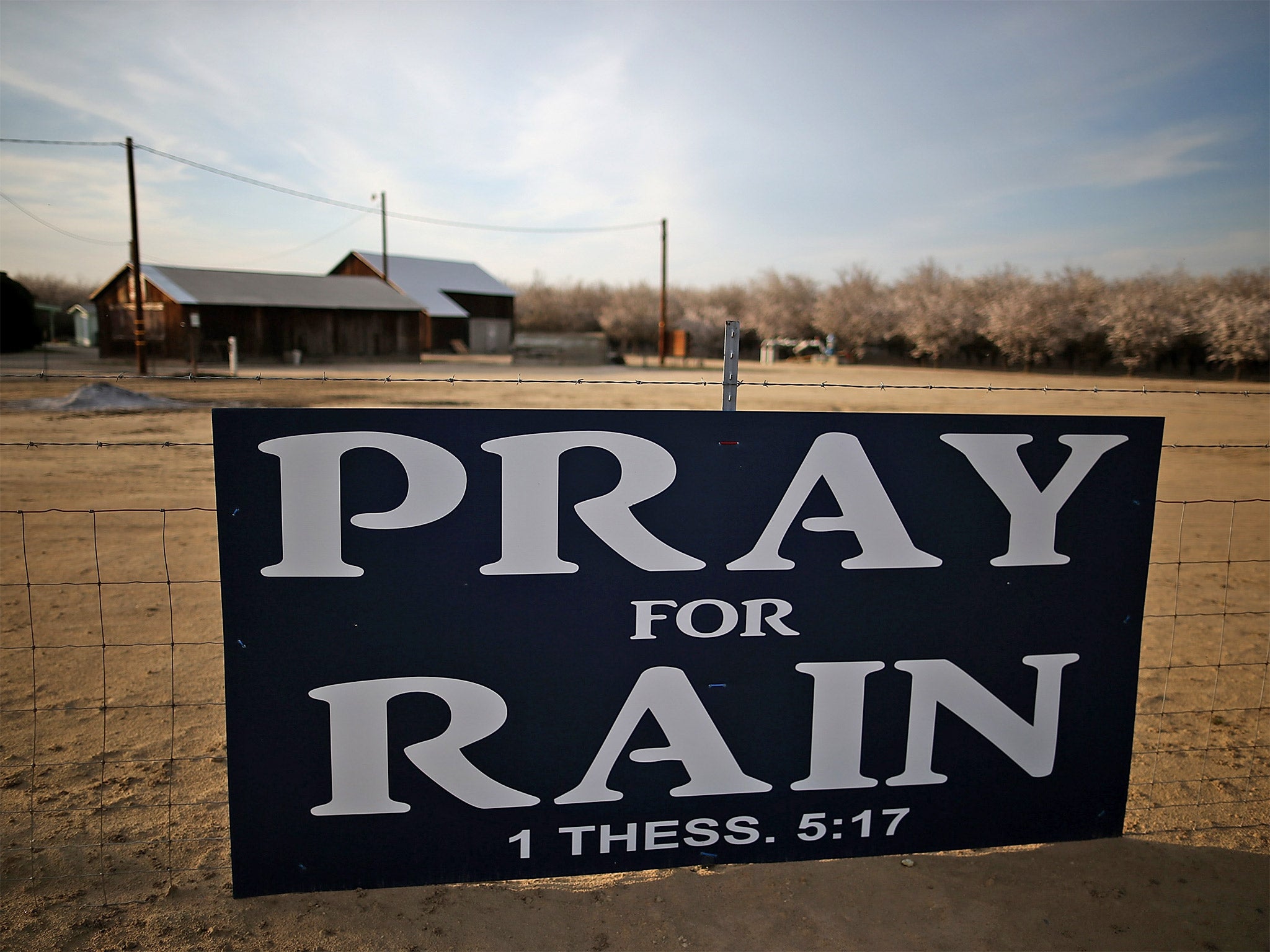 A sign is posted near a farm in Turlock, California. The US state is currently enduring one of the most severe droughts on record (Getty)