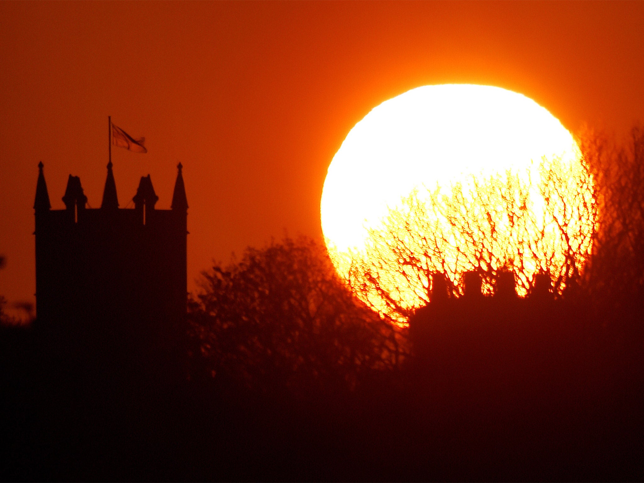 The sun balances next to St Albans Church in Earsdon, North Tyneside. Temperatures in Briatin this week equalled the Mediterranean island of Ibiza