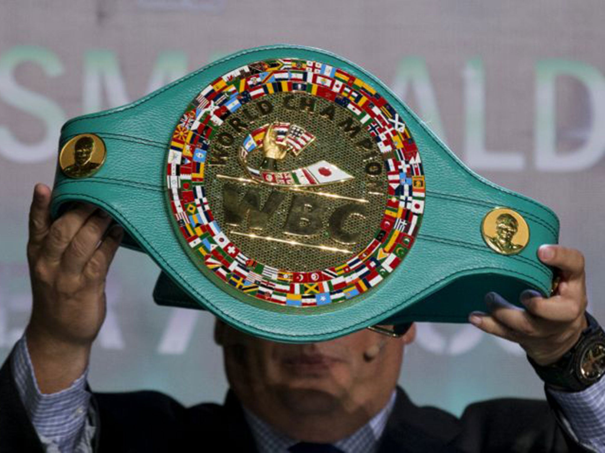 Mauricio Sulaiman, president of the World Boxing Council, holds up the $1m Emerald Belt