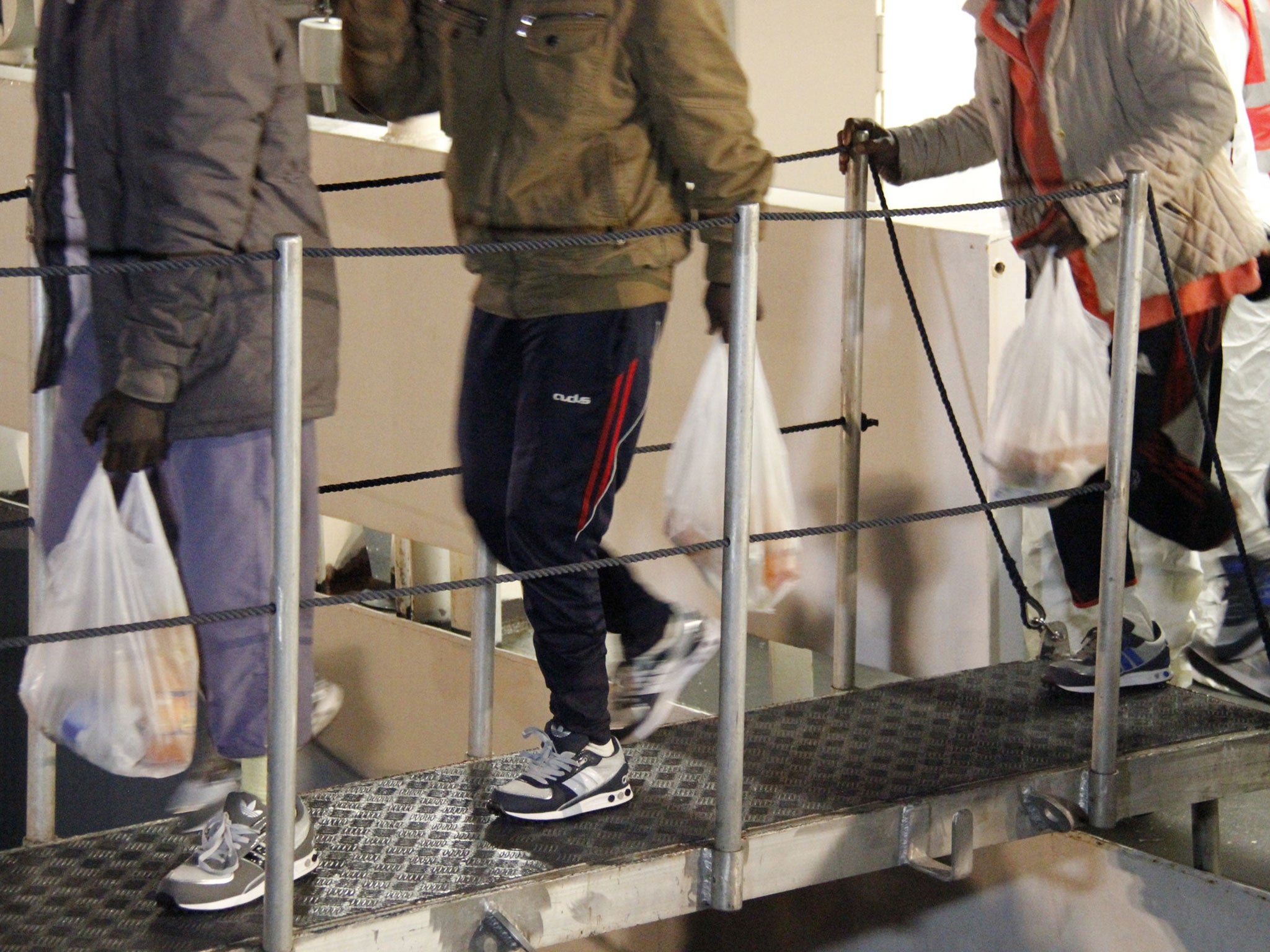 Boys who survived the migrant boat disaster that killed 800 people on 19 April arriving at a rescue centre in Italy.