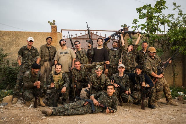 A group of international foreign fighters pose for a photo on April 16, 2015, in the outskirts of the north-western Syrian town of Tal Tamr 