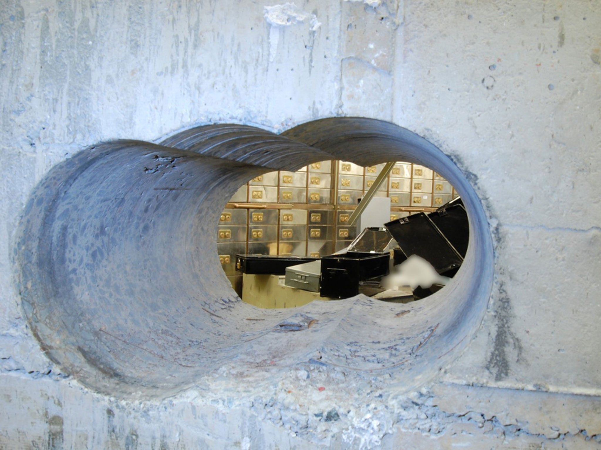 The thieves used a heavy duty drill to bore huge holes into the concrete vault wall