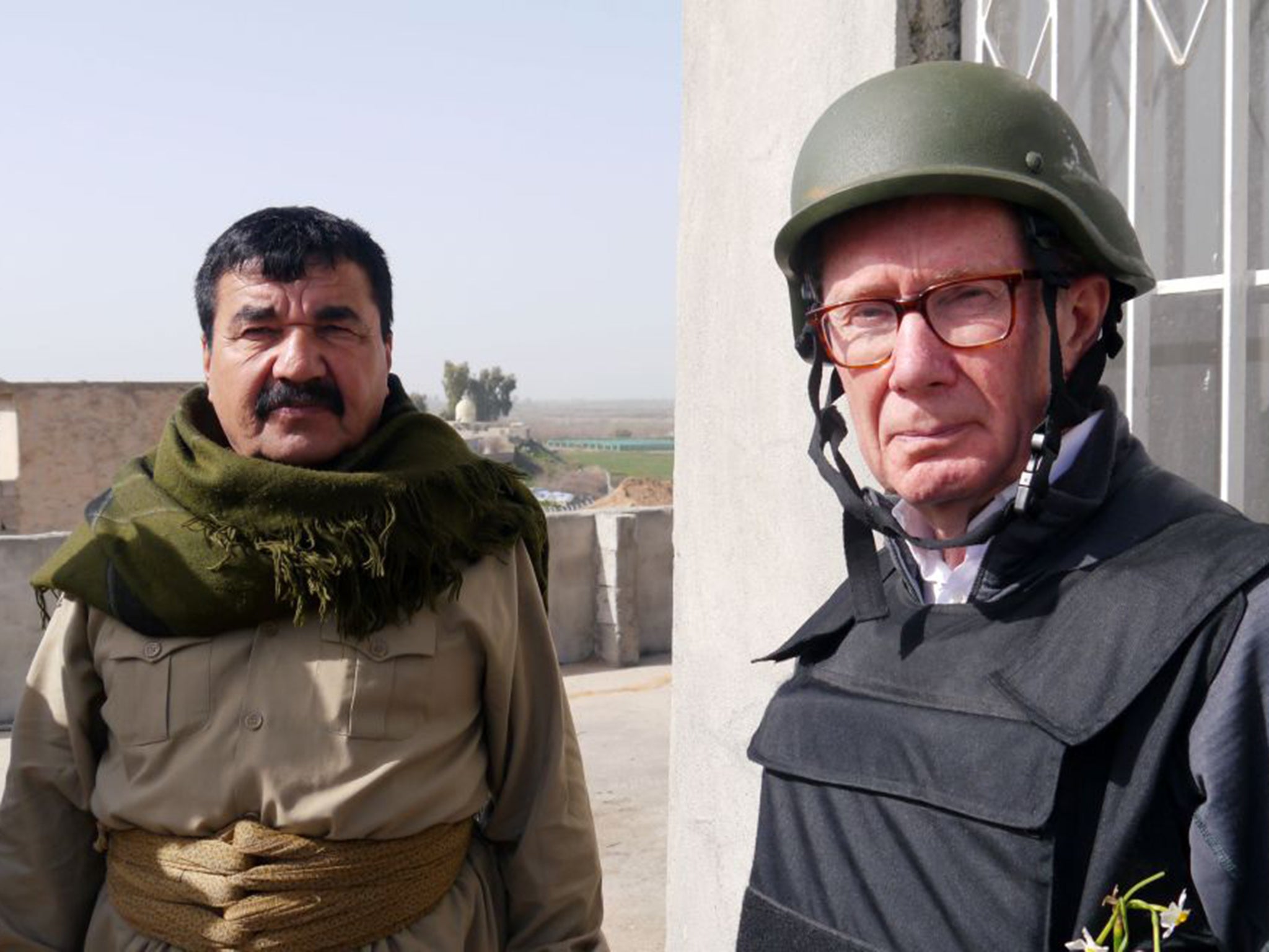 Frontline: Peter Taylor, right, meets a Kurdish Peshmerga fighter in Guer, northern Iraq