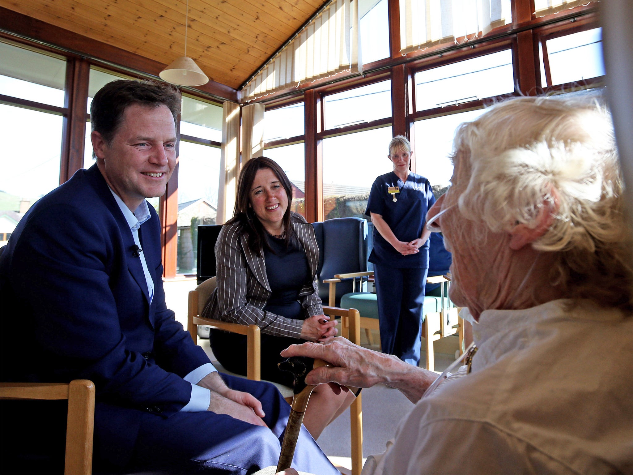 Lib Dem leader Nick Clegg and local candidate Jane Dodds meet staff and patients at Llanidloes and District War Memorial Hospital in Powys, Wales, on Wednesday