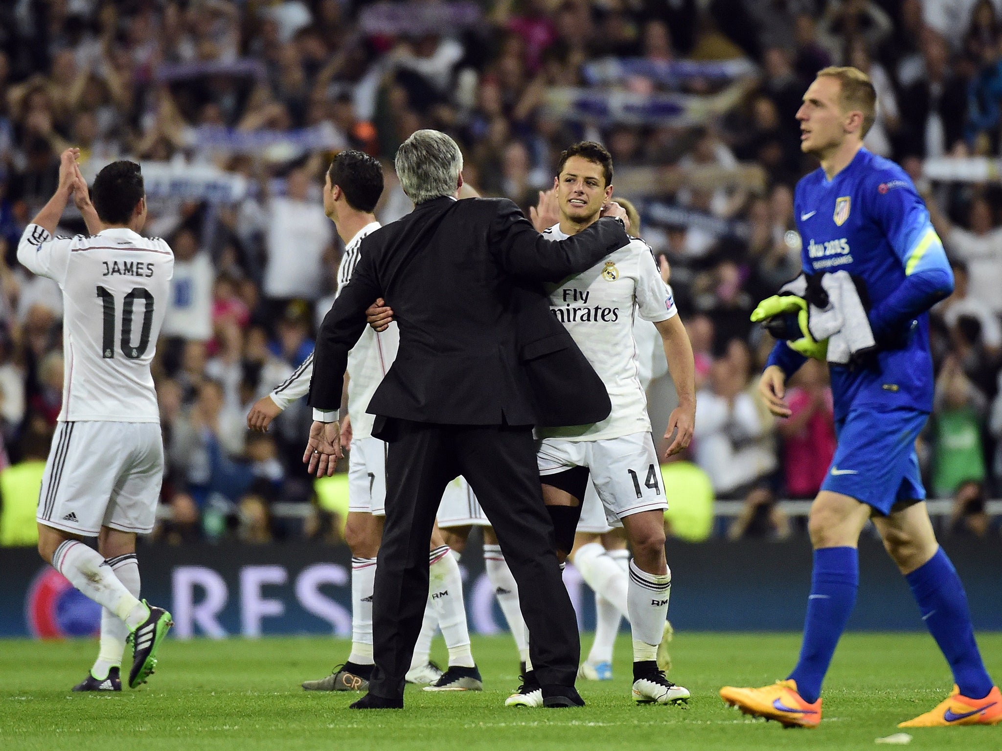 Carlo Ancelotti and Javier Hernandez celebrate victory for Real Madrid