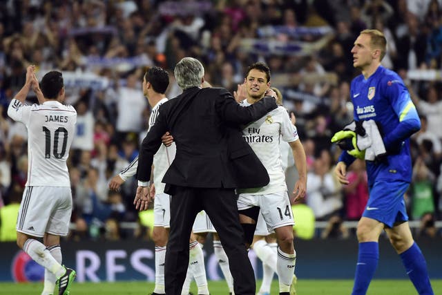 Carlo Ancelotti and Javier Hernandez celebrate victory for Real Madrid