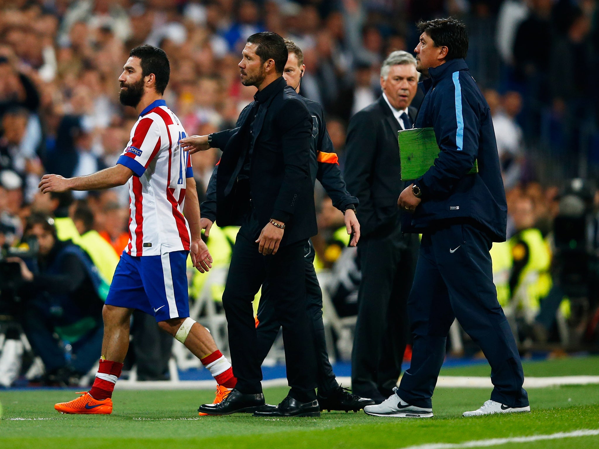 Diego Simeone tries to console Arda Turan