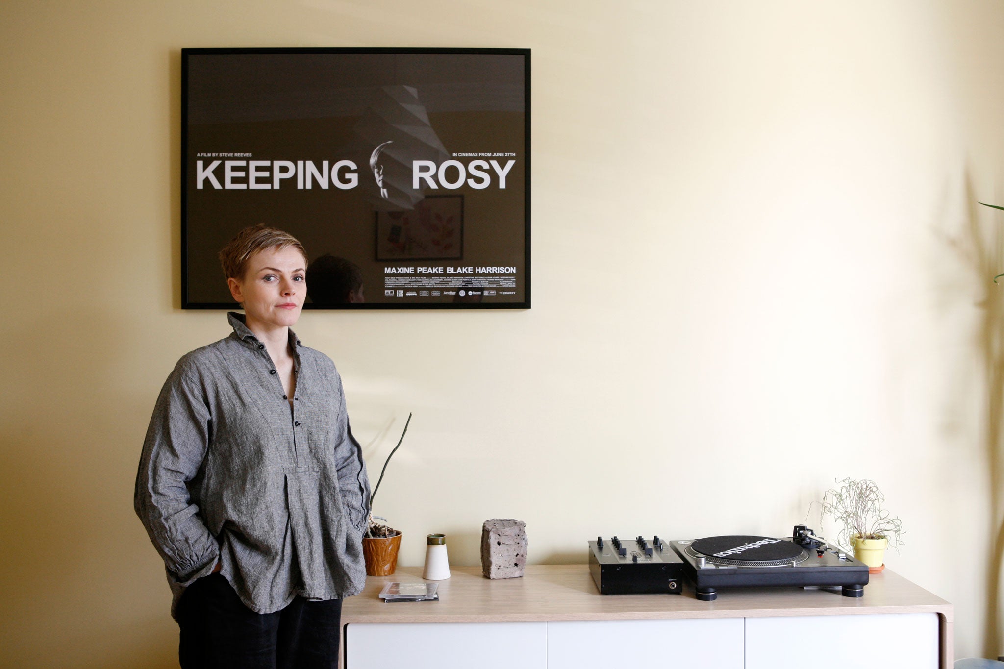 Maxine Peake at home in front of a poster for Keeping Rosy