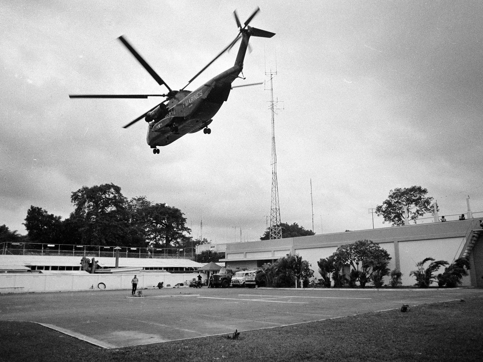 A helicopter lifts off from the US embassy in Saigon, Vietnam during last minute evacuation of authorized personnel and civilians on 29 April 1975