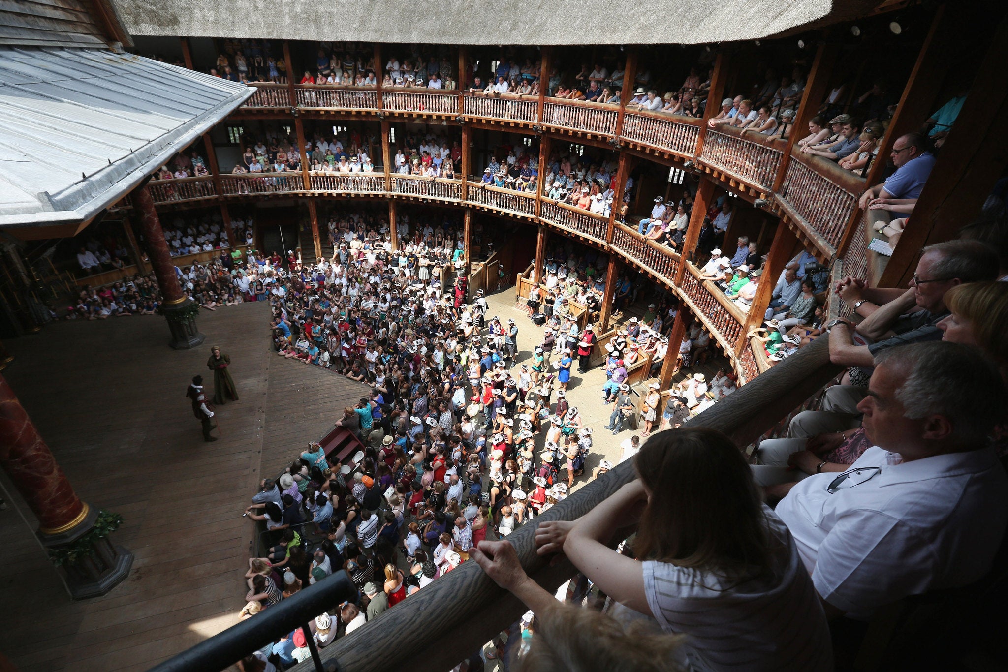 Crowds watch a performance at Shakespeare's Globe theatre
