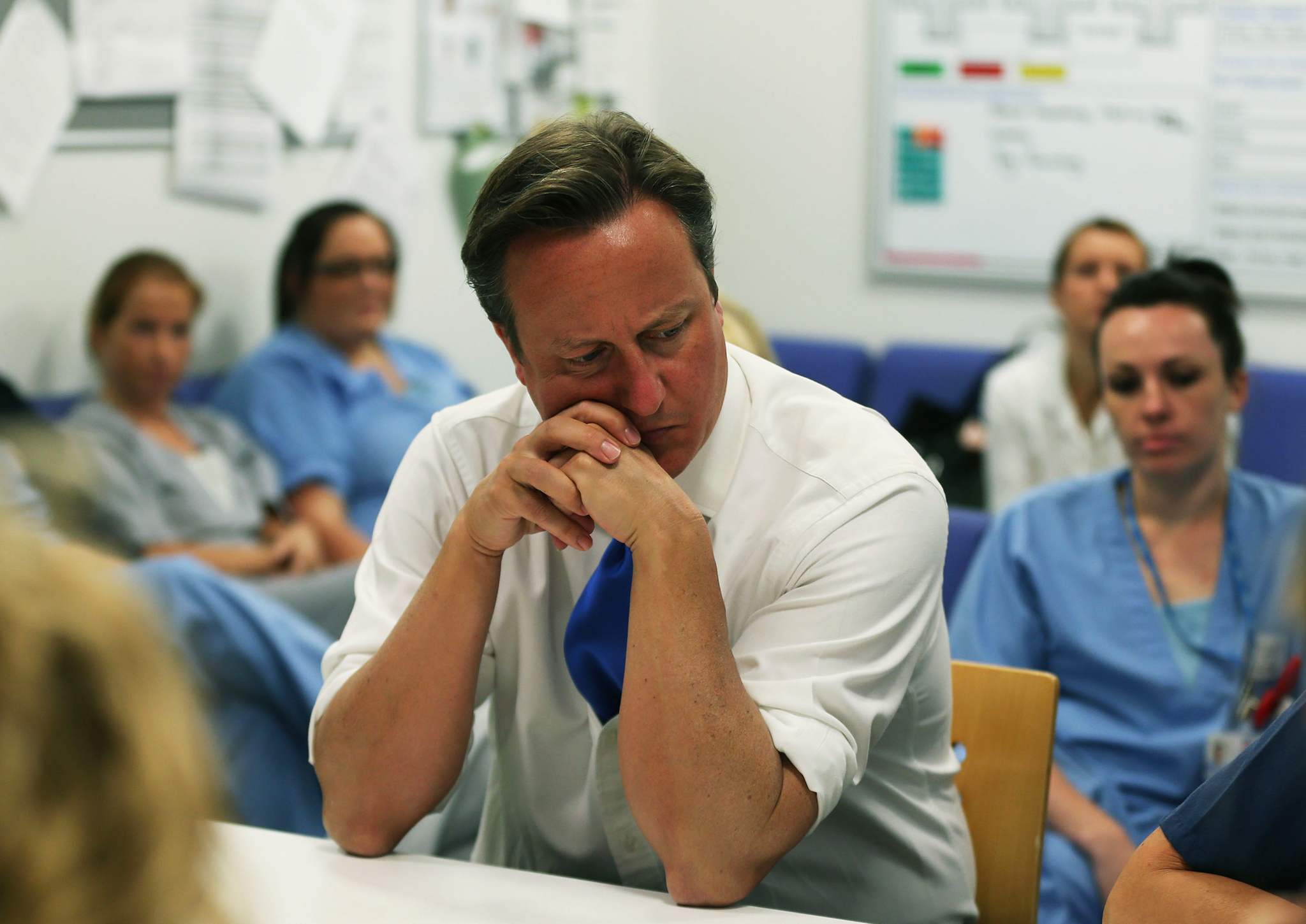 David Cameron talks to staff during a visit to the Salford Royal Hospital accident and emergency department