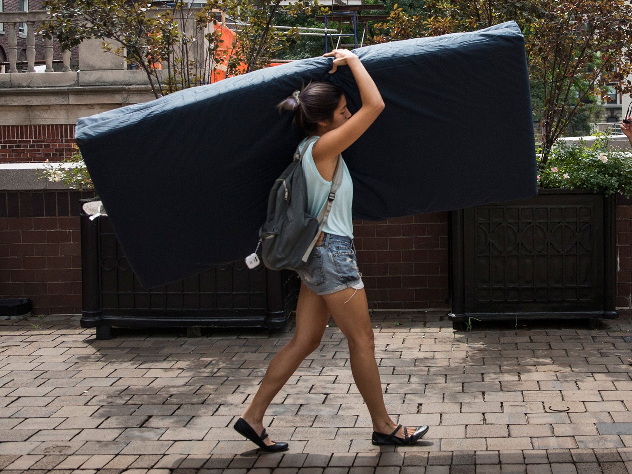 Emma Sulkowicz, a senior visual arts student at Columbia University, carries a mattress in protest
