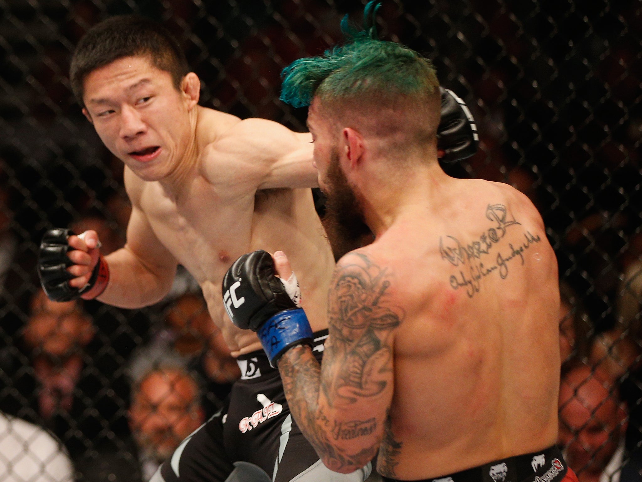 Kyoji Horiguchi punches Louis Gaudinot (Josh Hedges / Zuffa LLC)