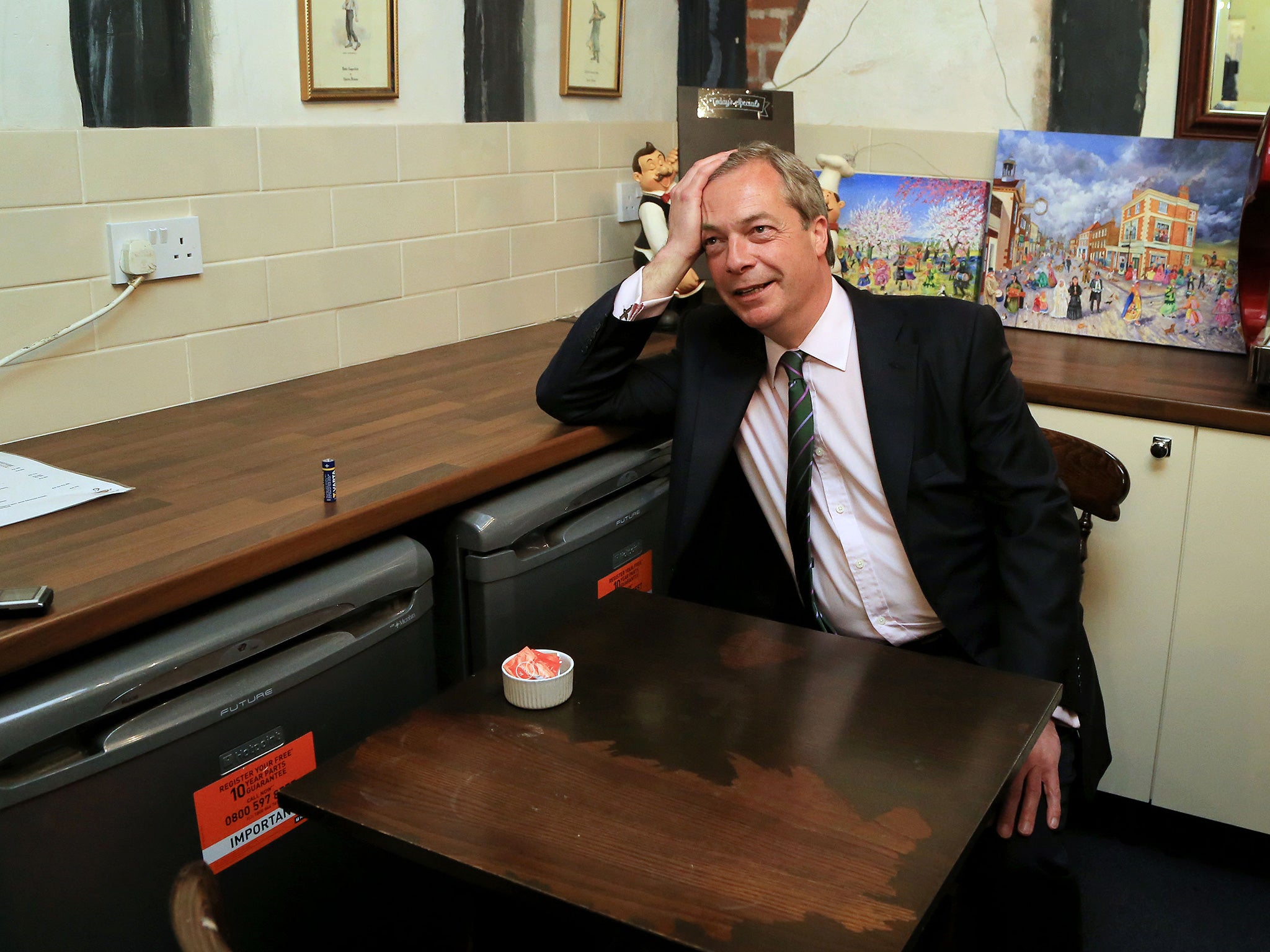 Ukip leader Nigel Farage in Tiny Tim’s tea shop while canvassing in Rochester this week