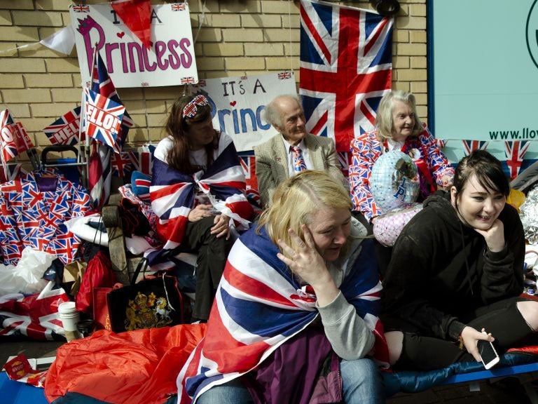 Royal fans covered with Union Jacks and royal memorabilia wait for Kate, Duchess of Cambridge to go into the Lindo wing at St Mary's Hospital to give birth to her second child