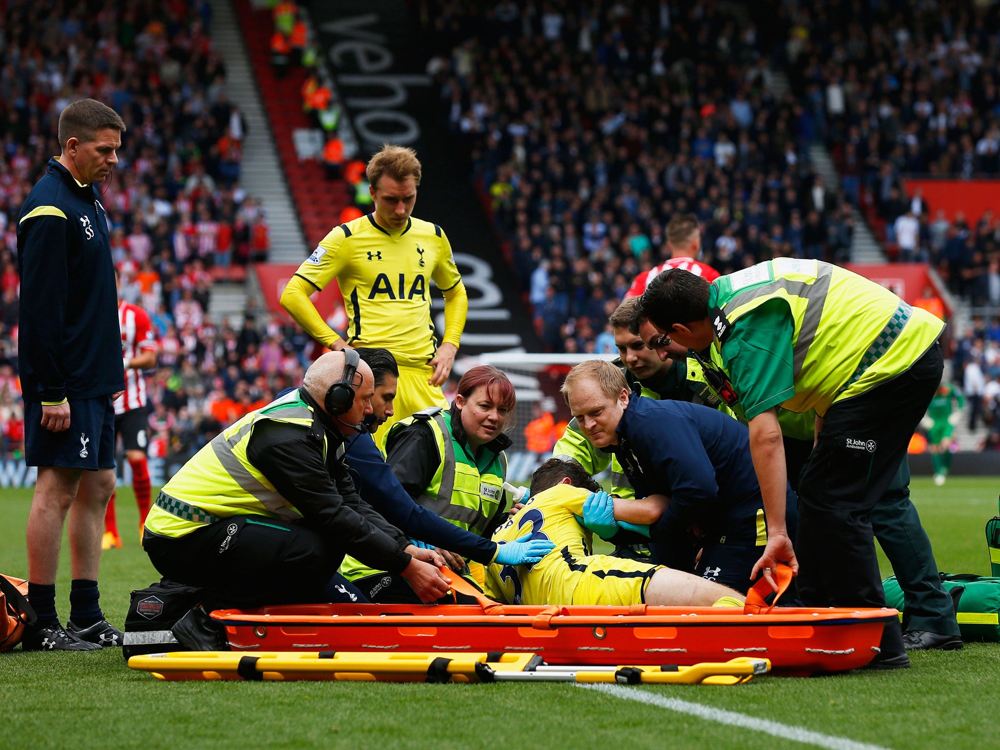 Ben Davies is carried off with a suspected dislocated shoulder