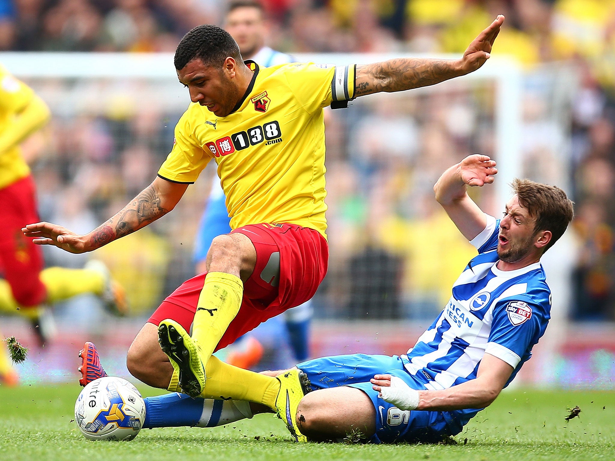 Troy Deeney is tackle by Dale Stephens