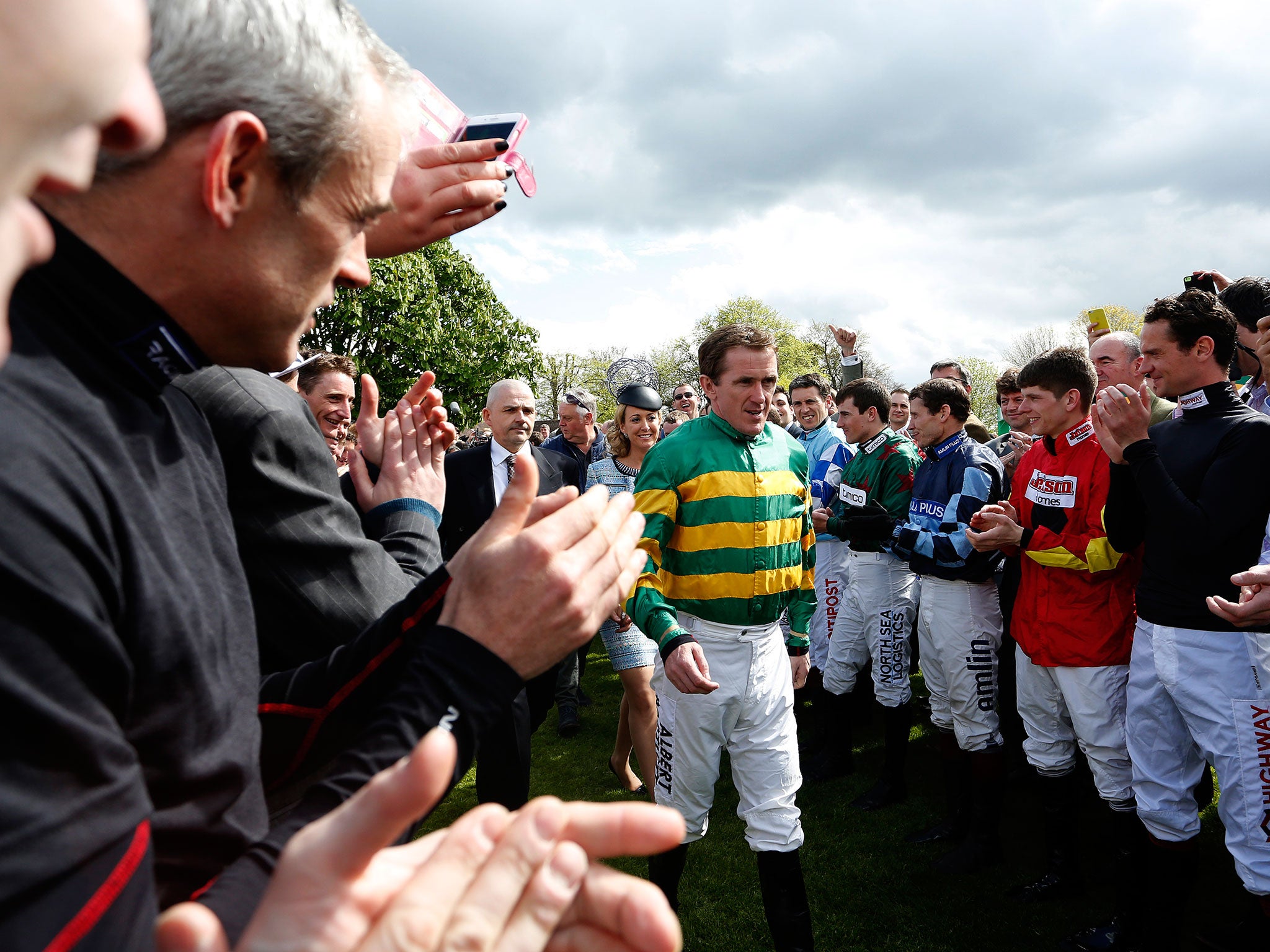 Jockey's greet Tony McCoy as he prepares for his final ride