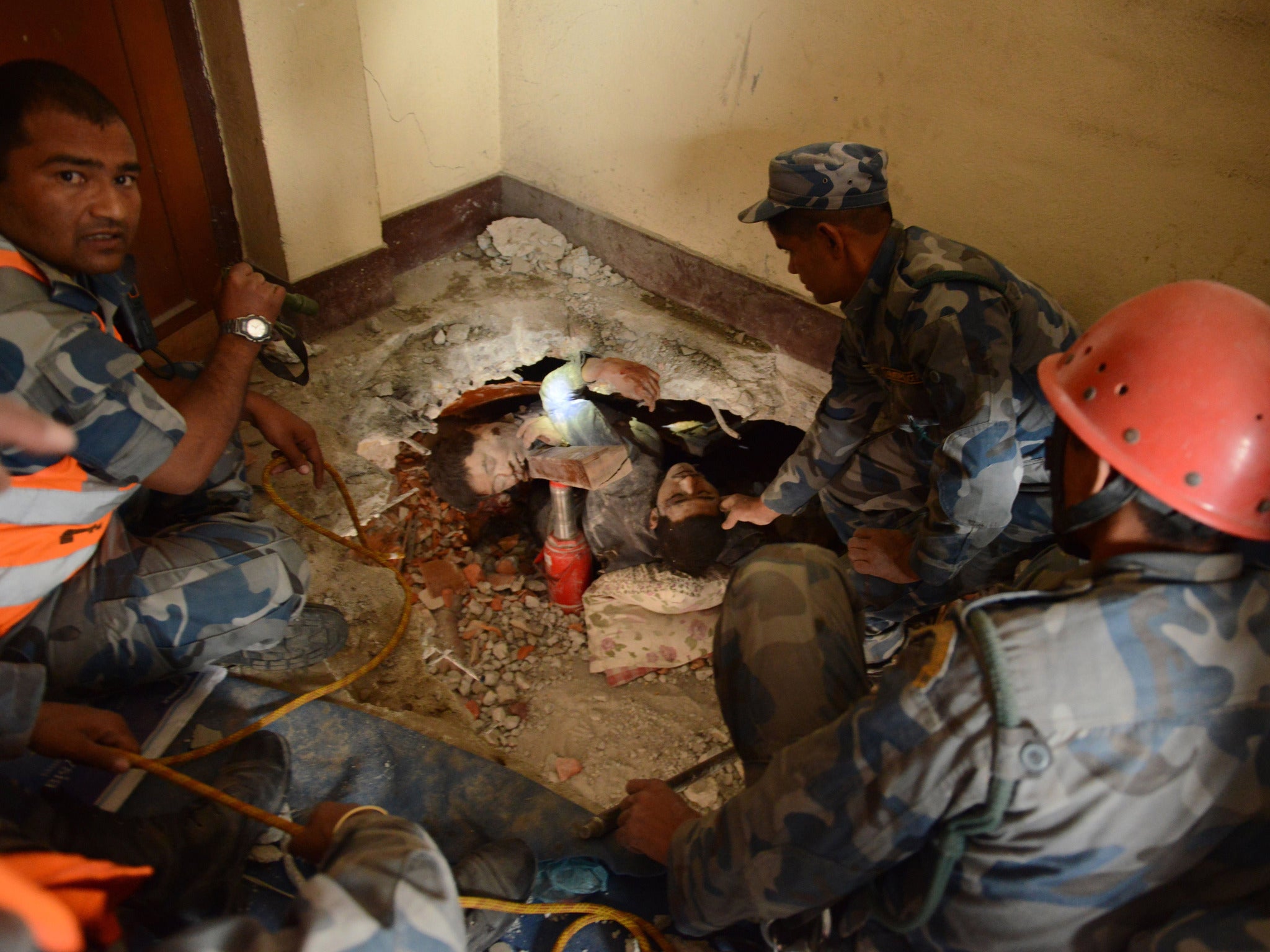 Rescuers were forced to dig with their bare hands to reach survivors (Getty)