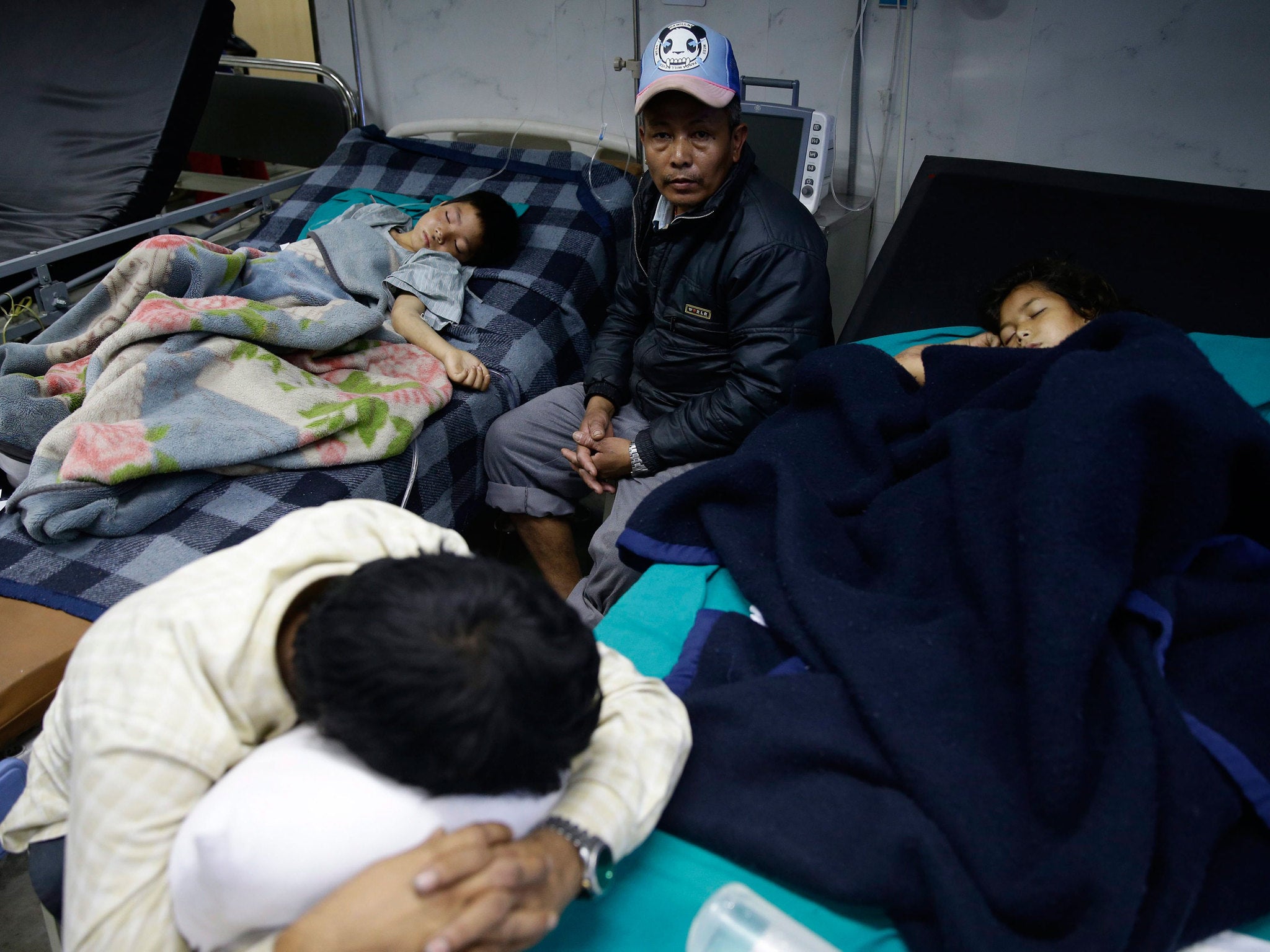 Injured people wait for medical treatment at Bir Hospital in Kathmandu