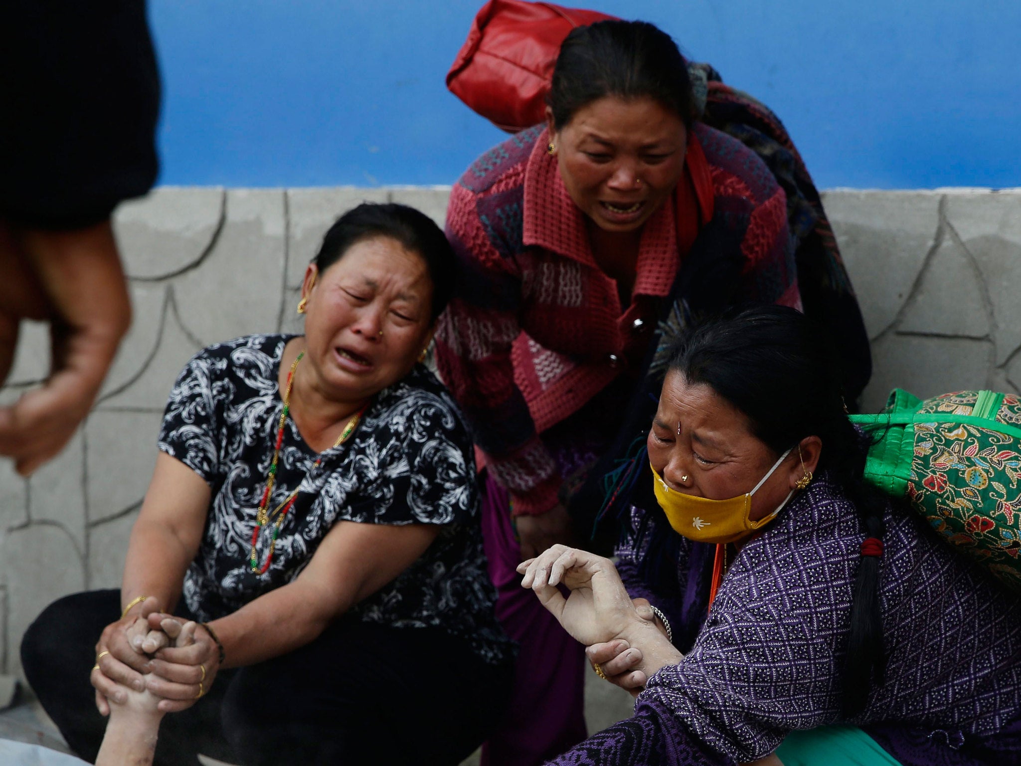 Relatives cry over a dead body of a victim at Bir Hospital in Kathmandu
