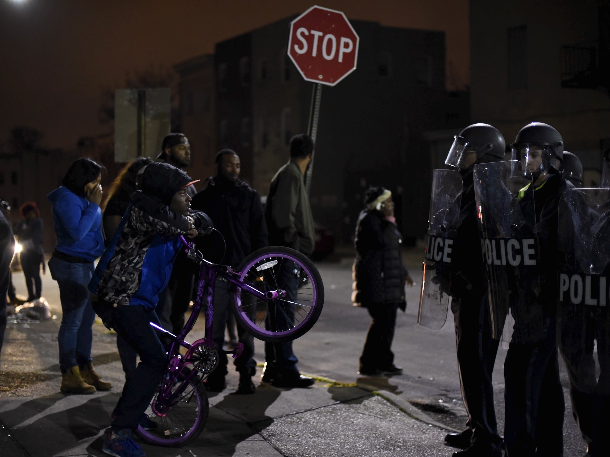 Police and protesters face off in Baltimore during unrest over the death in custody of Freddie Gray