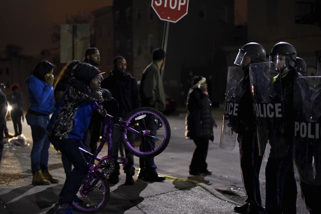 Police and protesters face off in Baltimore during unrest over the death in custody of Freddie Gray
