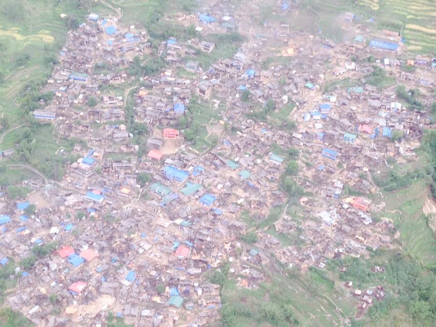 An aerial image shows the scale of destruction in Gorkha