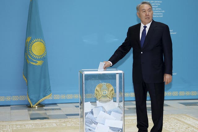 Kazakhstan's President and presidential candidate Nursultan Nazarbayev casts a ballot during a snap presidential election in Astana 
