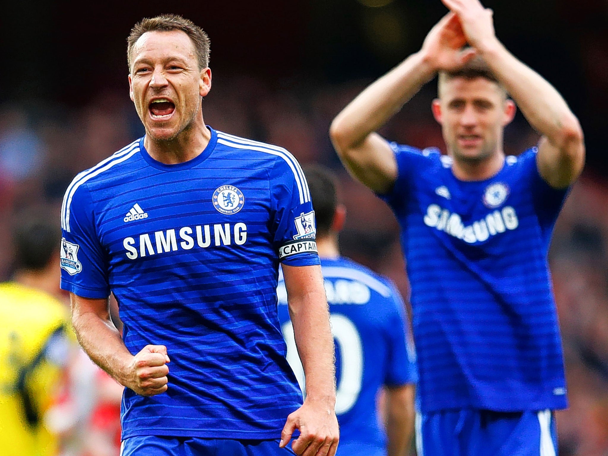 John Terry (left) and Gary Cahill celebrate after the draw at Arsenal which put Chelsea one step closer to the Premier League title