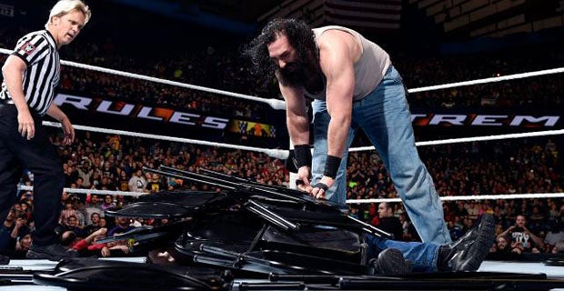 Harper buries Ambrose under a pile of chairs