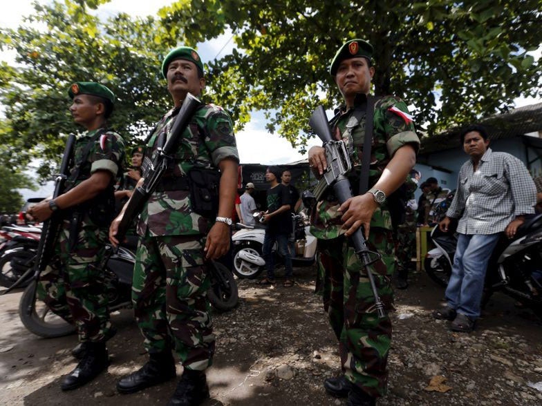 Indonesian soldiers stand as guard at Wijayapura port near the prison island of Nusa Kambangan