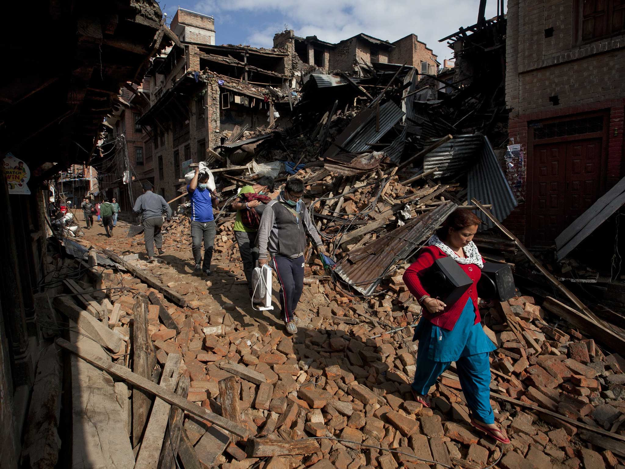 Residents of Kathmandu where much of the city remains without water or power