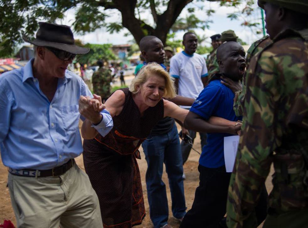 Hilary Monson, mother of Alexander, struggles as she is prevented from entering Ukunda police station in Kenya in May