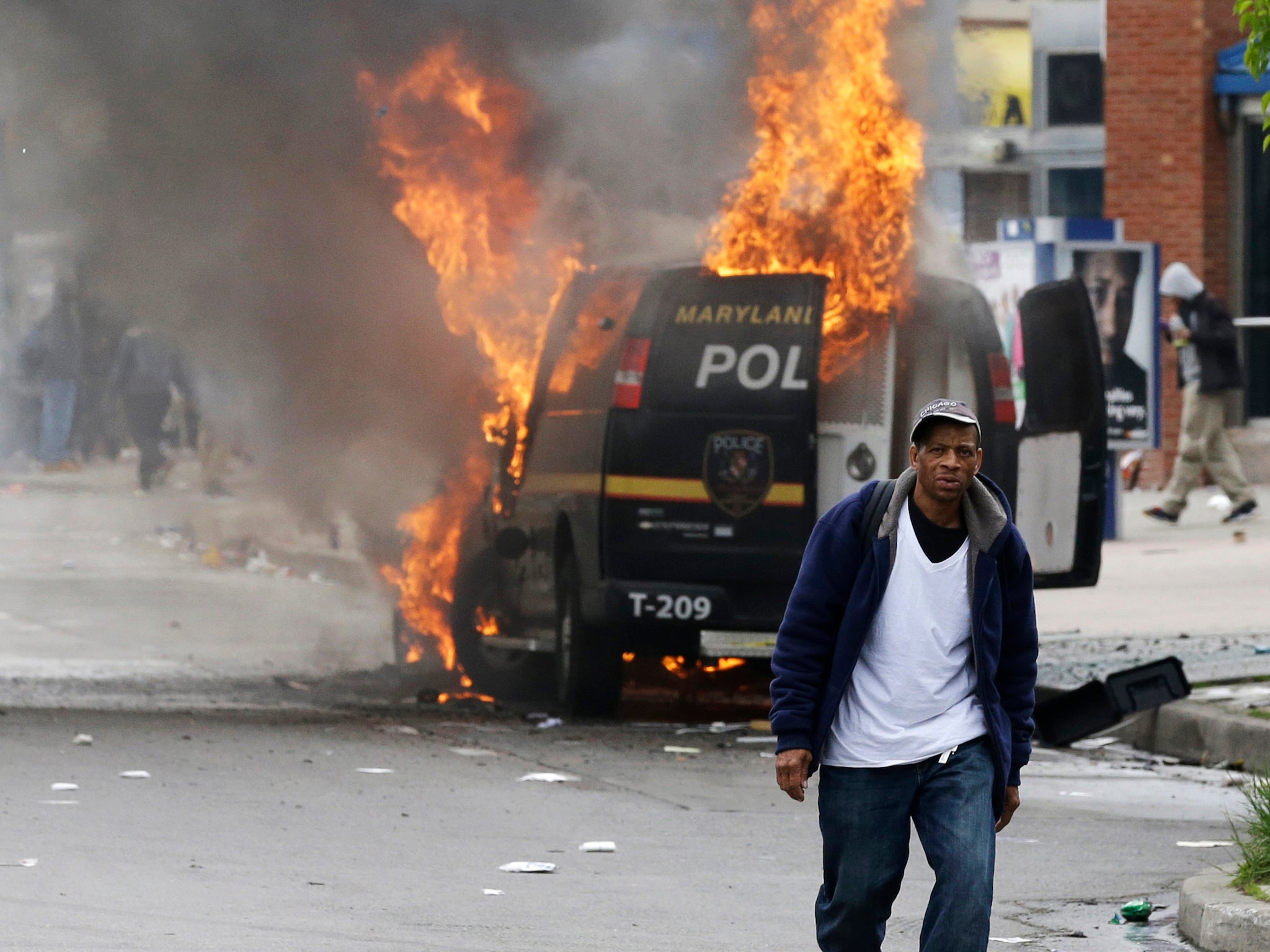 Riots burned police vehicles and pelted officers with stones