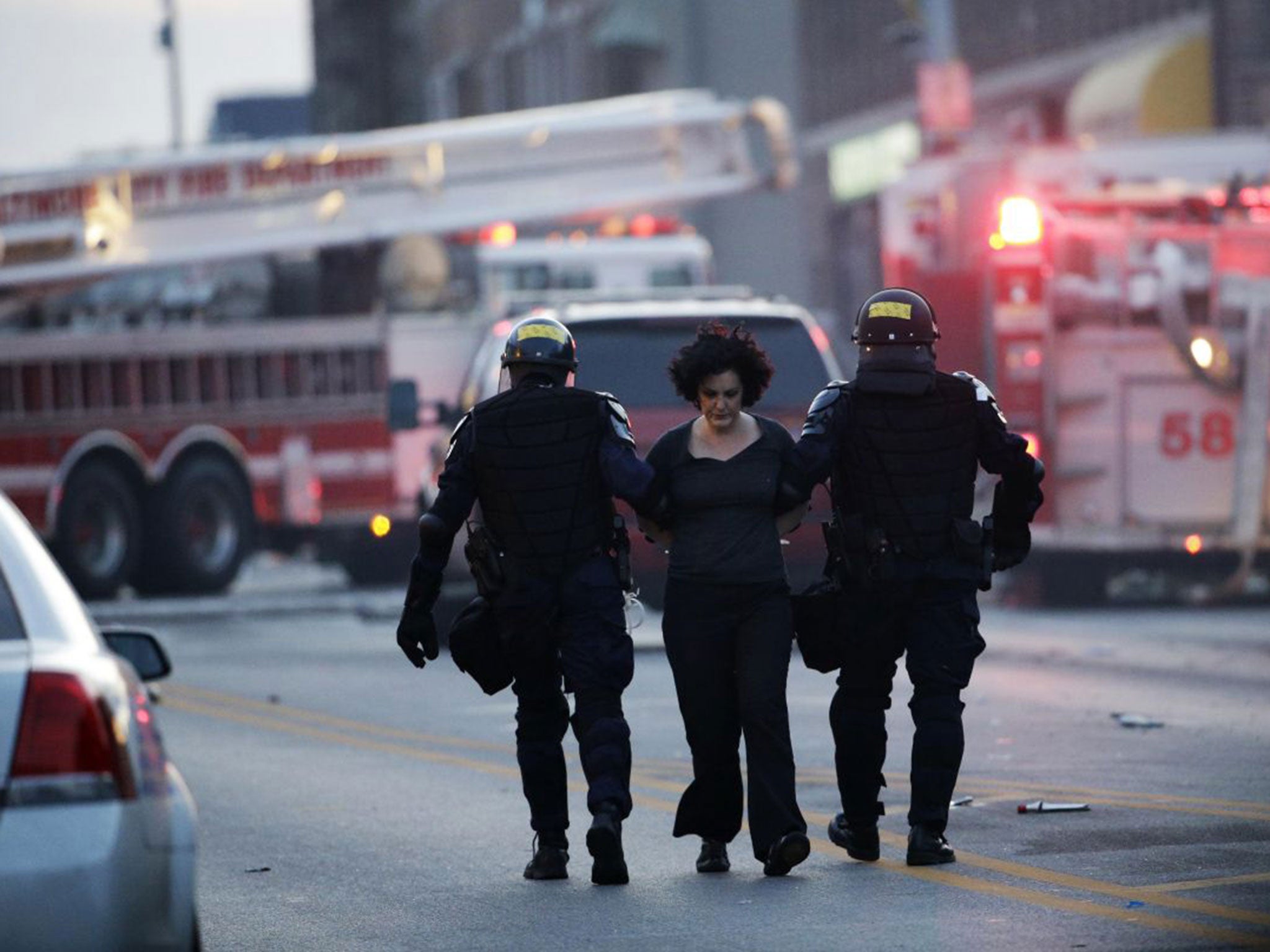 A protester is detained in Baltimore following the funeral of Freddie Gray earlier in the day