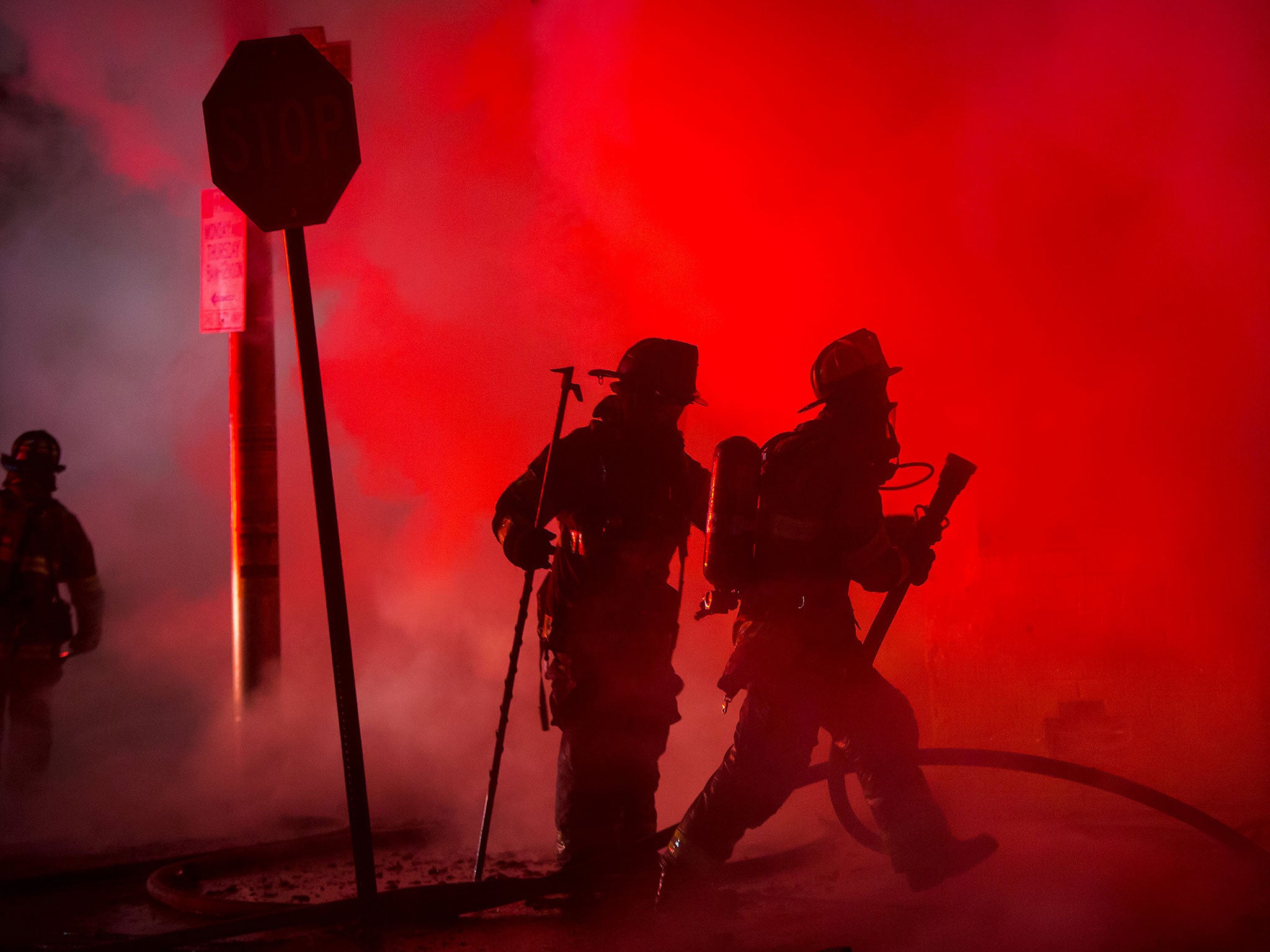 Baltimore firefighters attack a fire in a convenience store