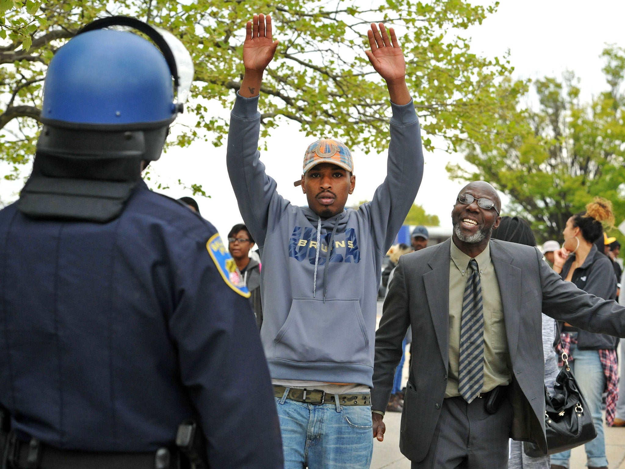 Protestors face police during unrest in Baltimore