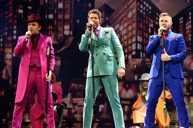 Take That's Mark Owen, Howard Donald and Gary Barlow perform at Glasgow's Hydro