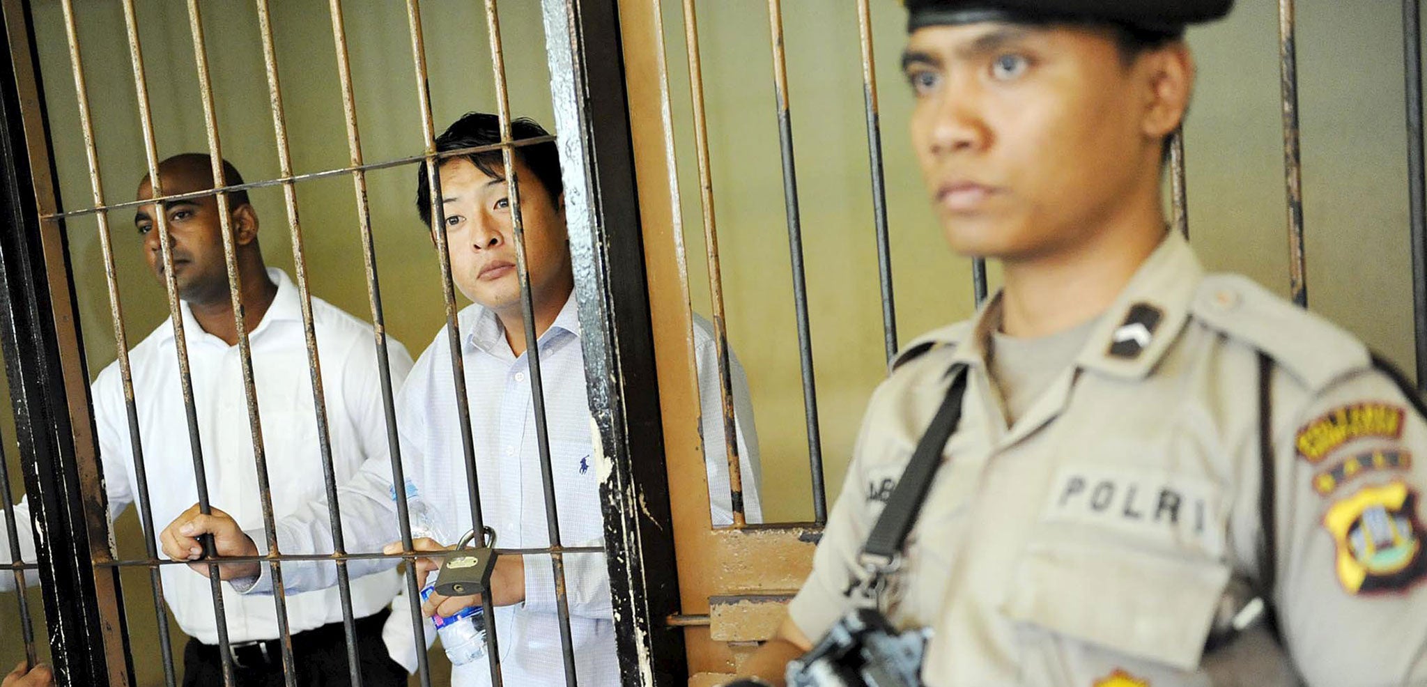 Andrew Chan and Myuran Sukumaran behind the bars