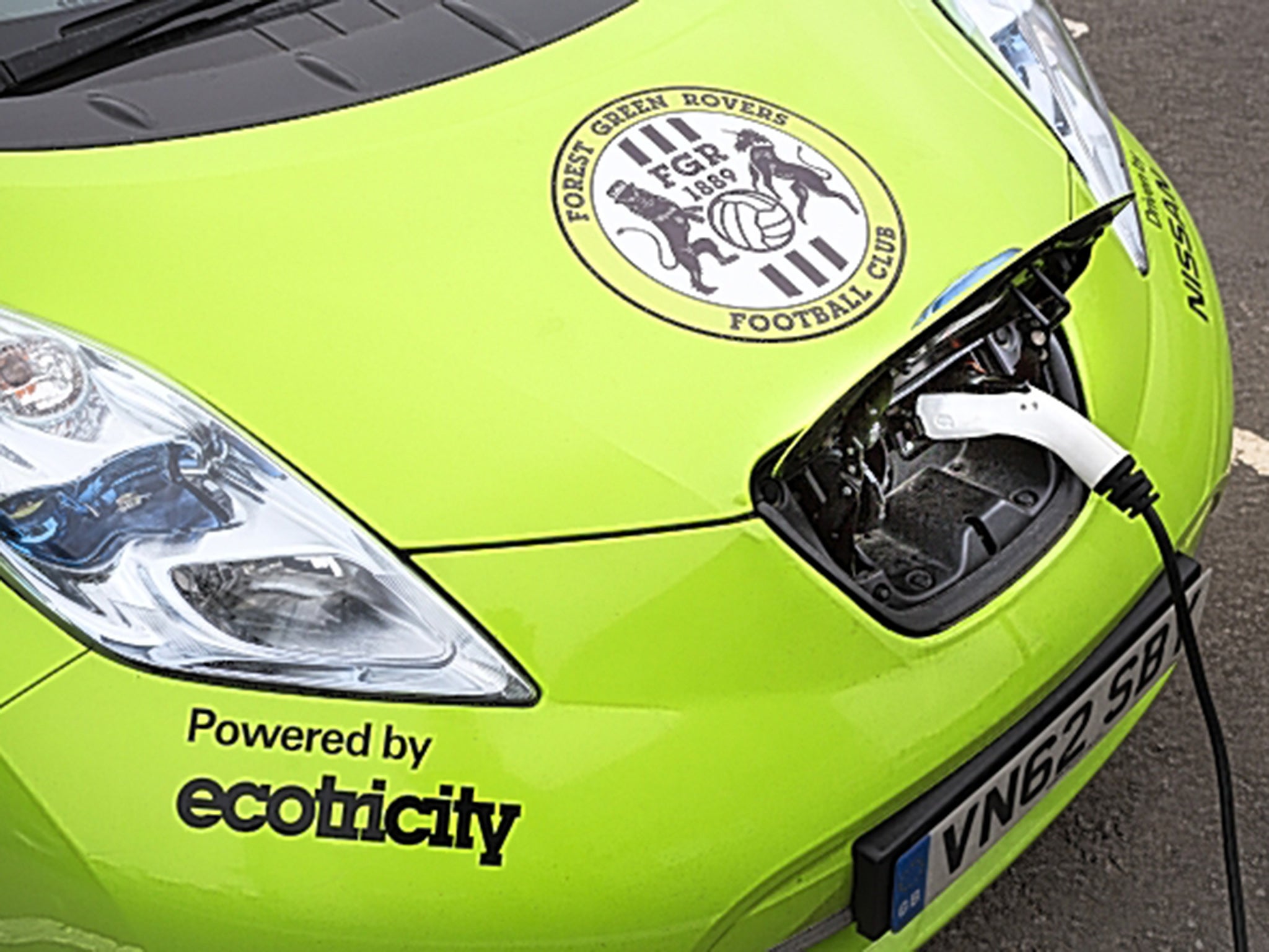 An electric club car being charged