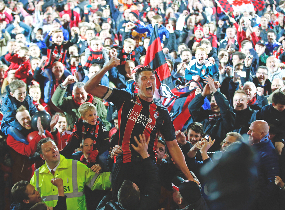 Bournemouth captain Tommy Elphick celebrates with the fans on Monday night