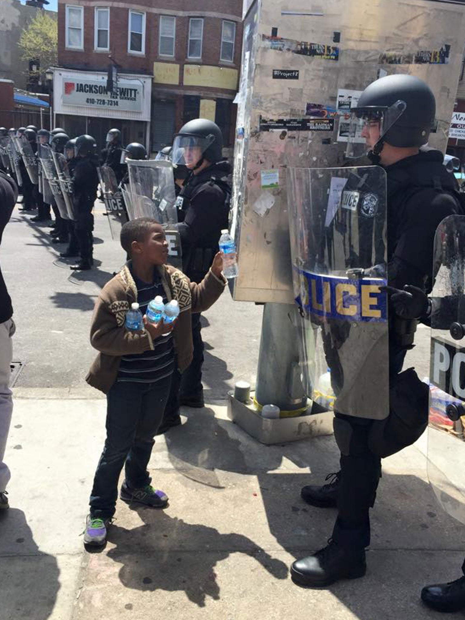 Baltimore riots The story behind the picture of a young boy handing