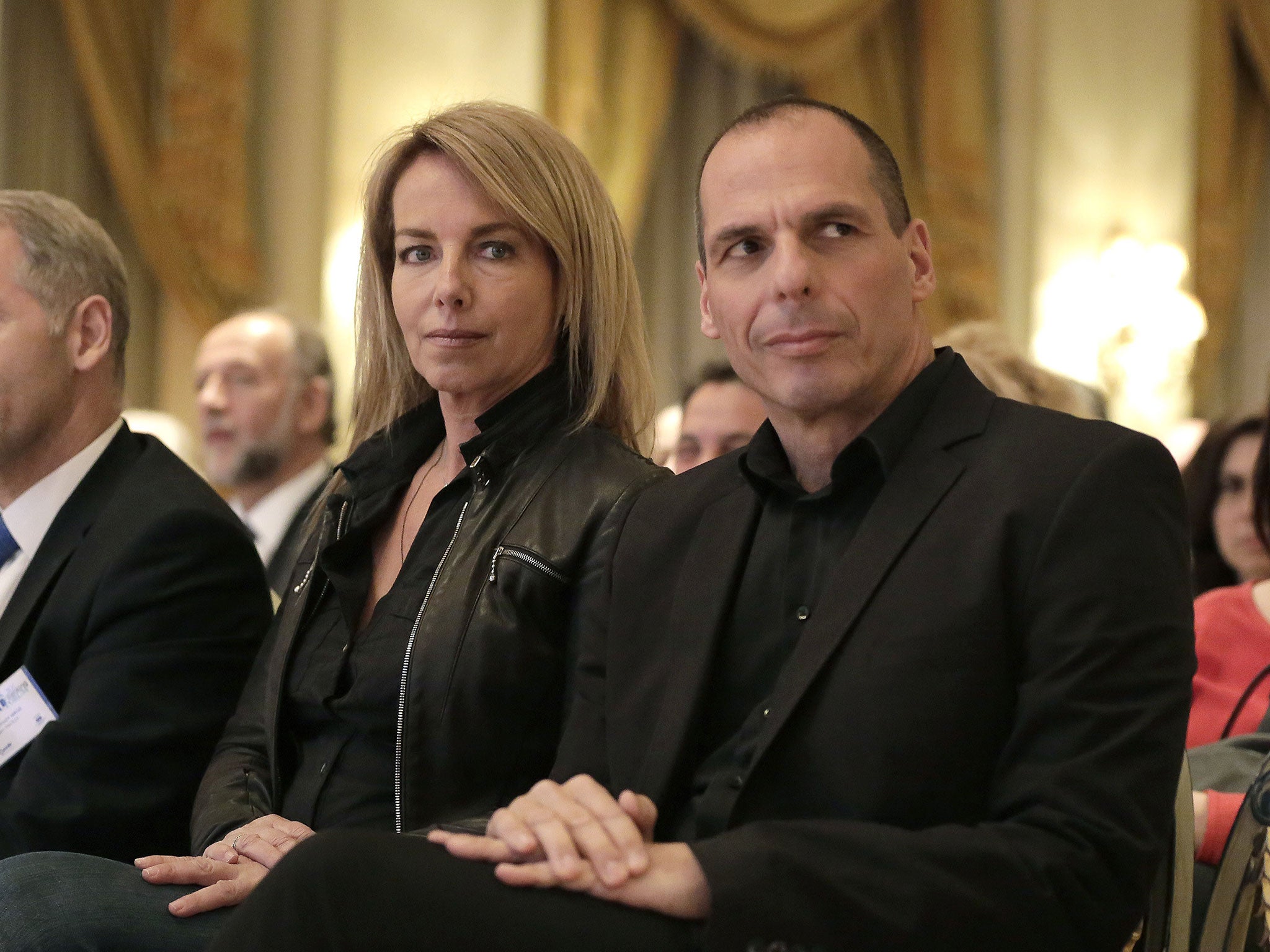 File: Greek Finance Minister Yanis Varoufakis, right, attends a banking conference in Athens with his wife Danae Stratou on 21 April