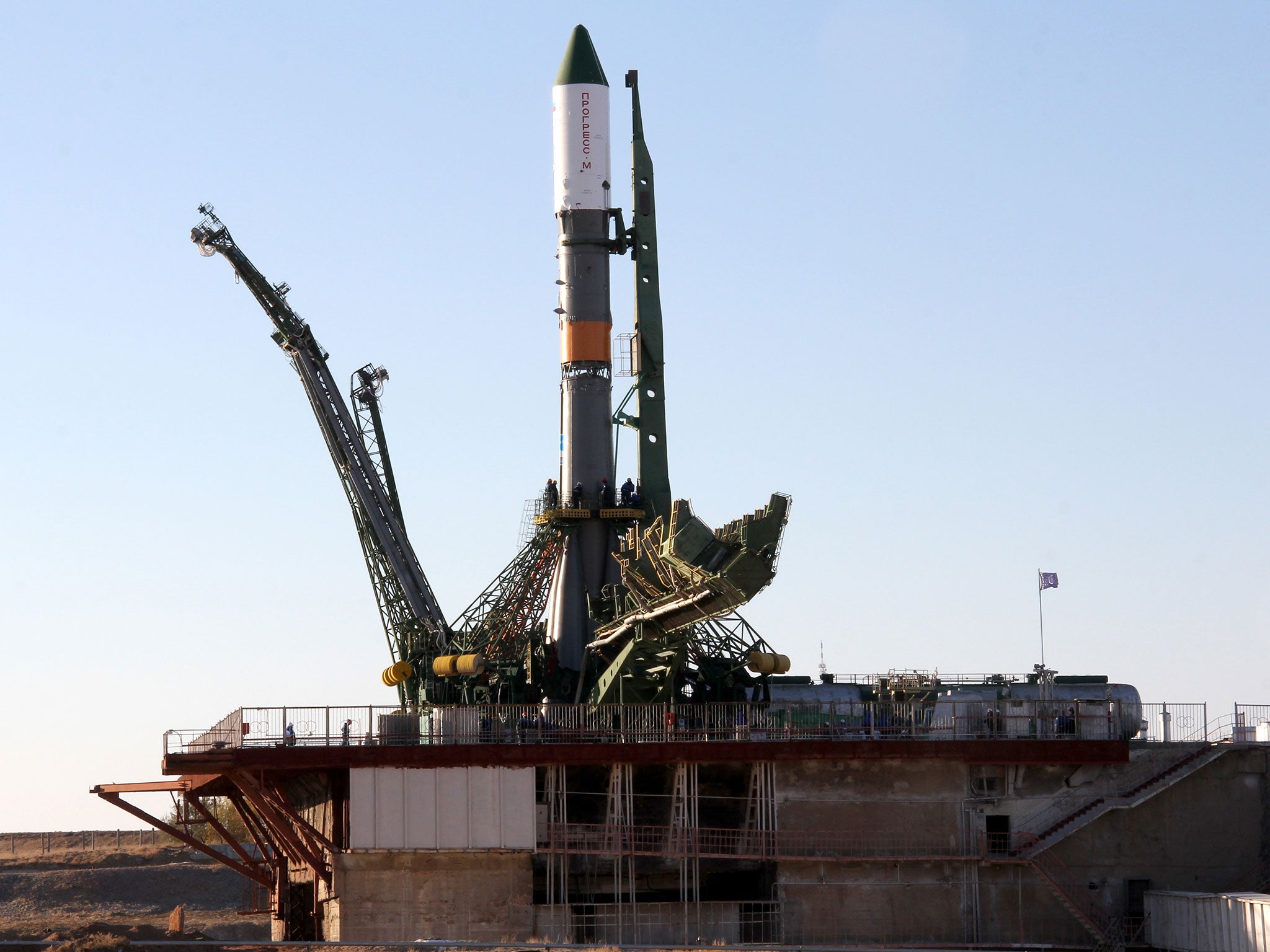 A Russian Soyuz-U booster carrying an unmanned cargo spacecraft Progress atop rises on a launch pad at the Russian leased Kazakhstan's Baikonur cosmodrome, on October 29, 2012