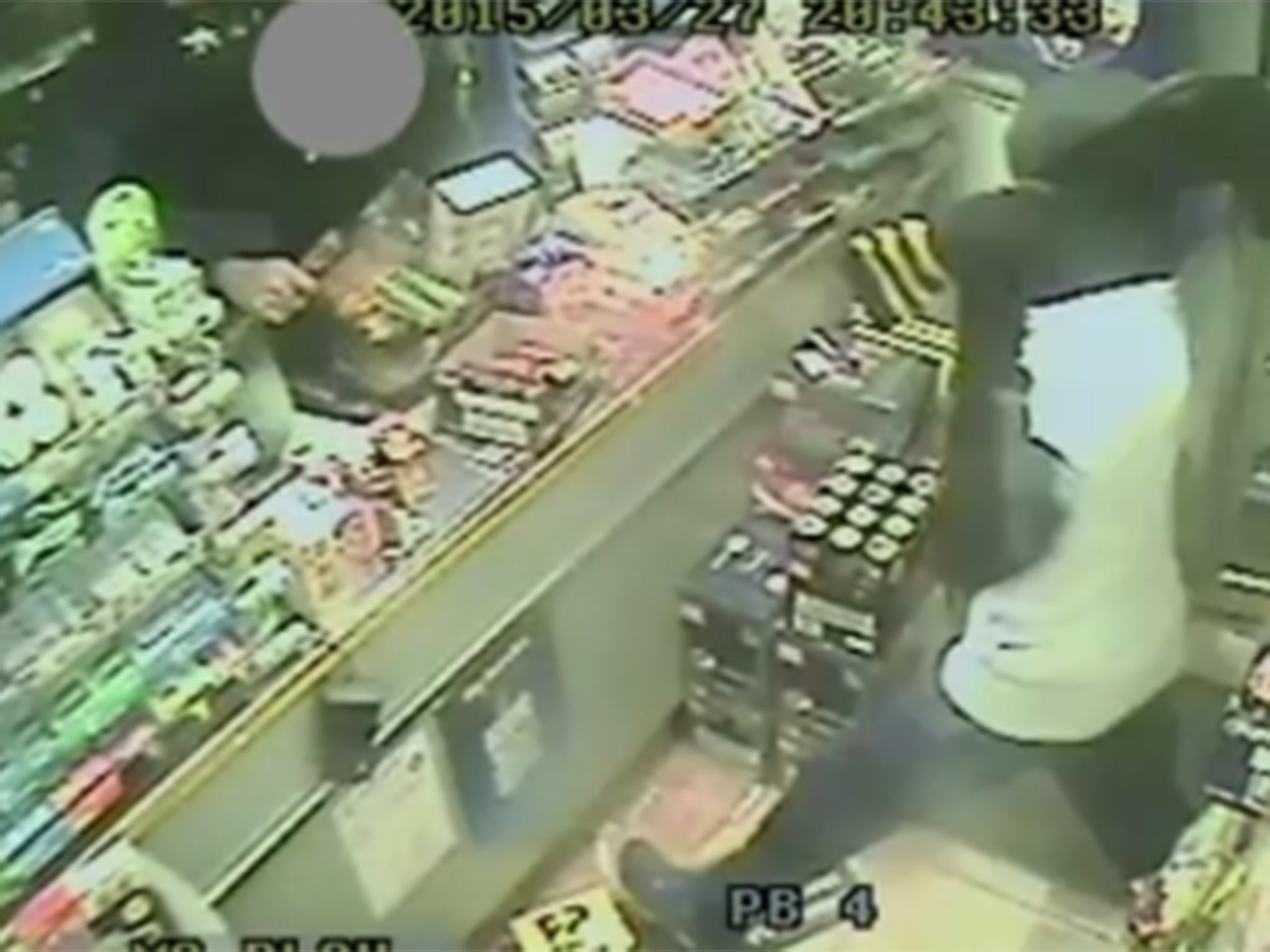 The moment one of the robbers attacks